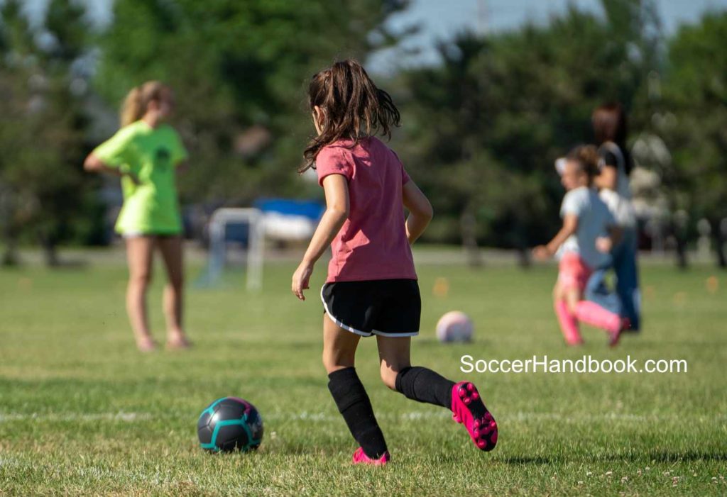 Youth soccer player dribbling - youth soccer game length