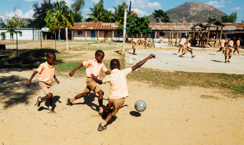 African kids playing soccer