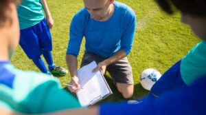 introduction to coaching youth soccer - a coach drawing drills