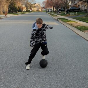 Youth soccer player doing a double step over