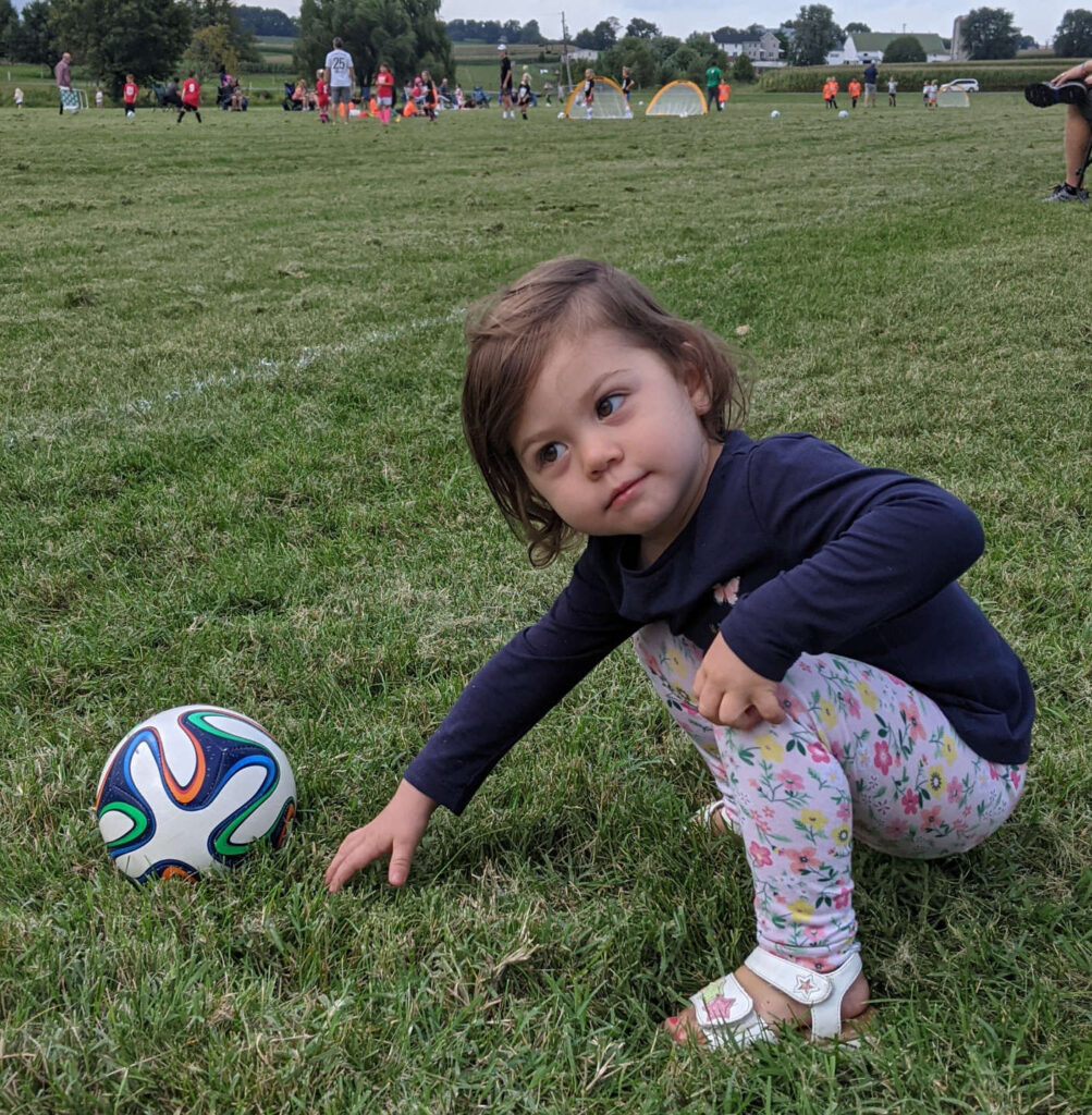two year old with size 1 soccer ball